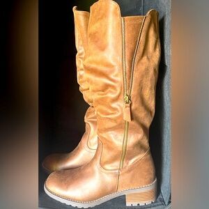 Brown Knee-High Boots
Brand new, great for looks and for the snow.